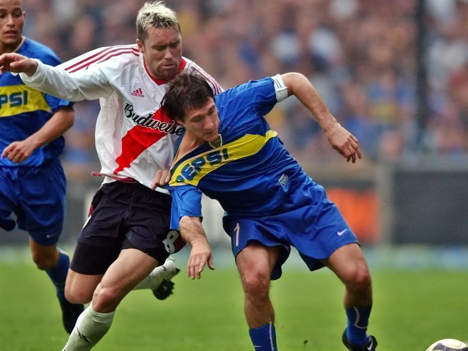 Eduardo Coudet y Guillermo Barros Schelotto en partidos del futbol argentino.